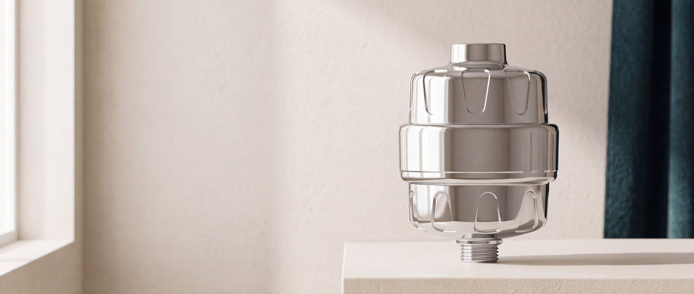 RinseKind shower filter on a sunlit stone platform